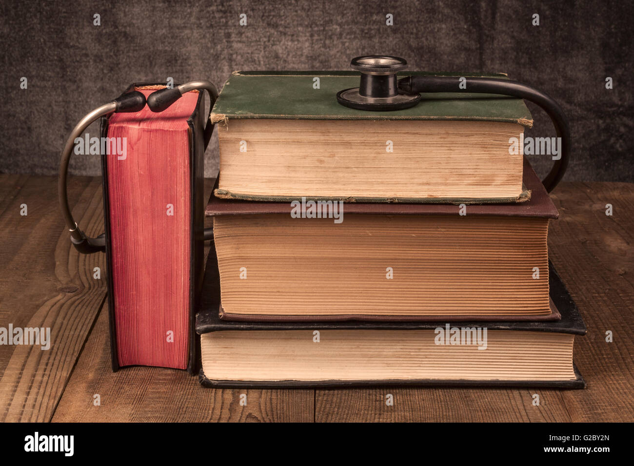 Old Books on Wood Table With Stethoscope Stock Photo - Alamy