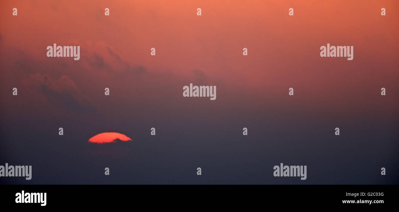 Red sun rising Stock Photo - Alamy