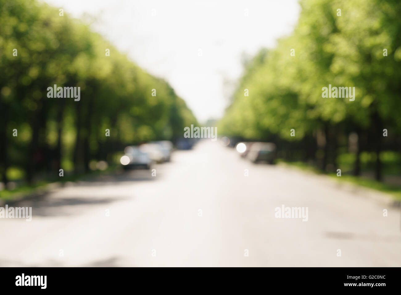 blurred background of town street in sunny summer day Stock Photo