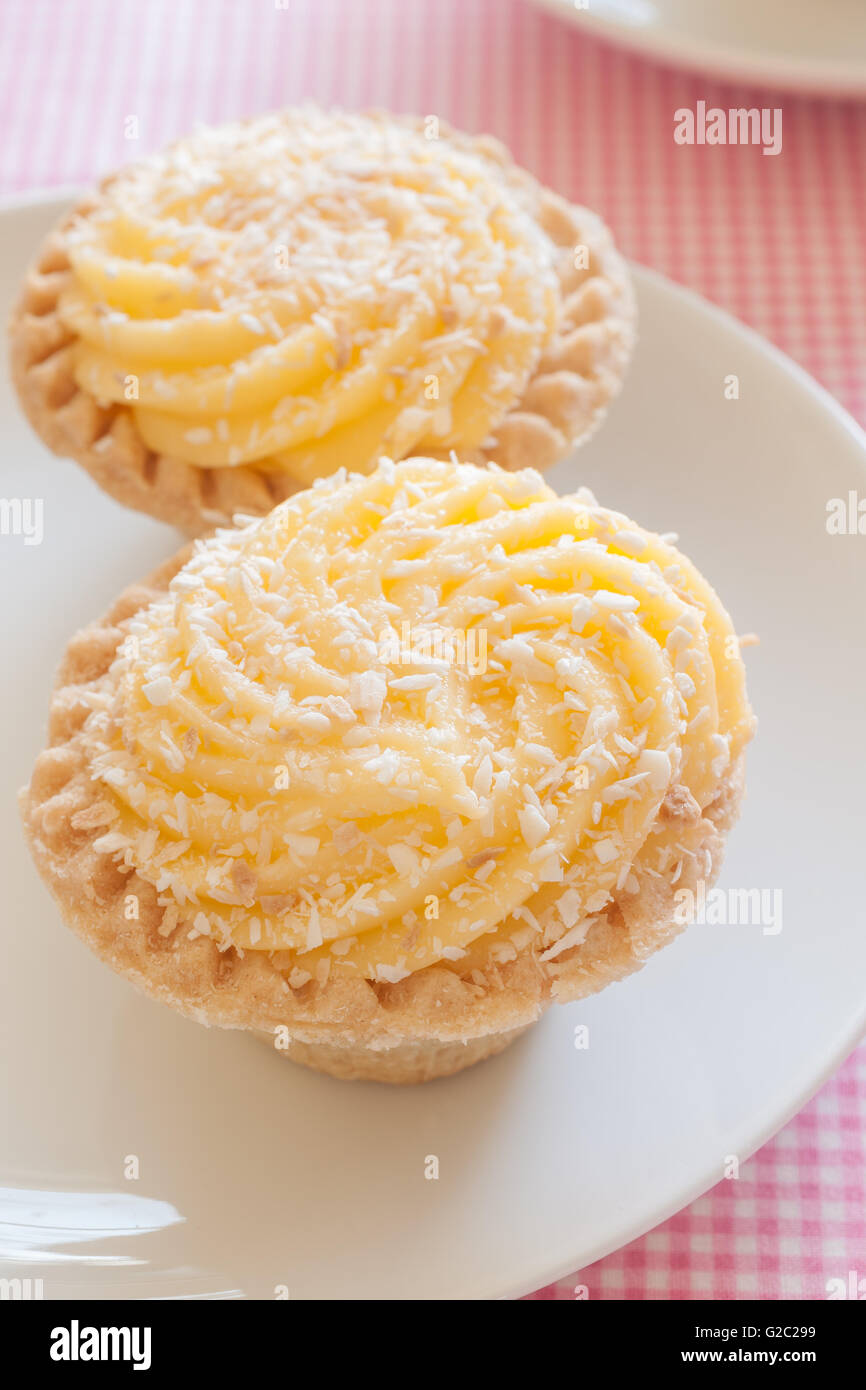 Manchester Tarts pastry cases filled with jam and egg custard dusted
