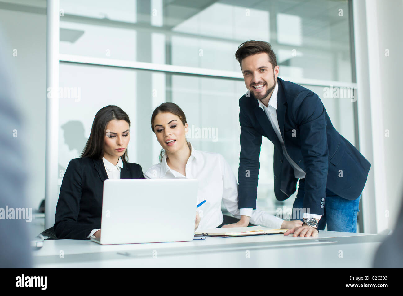 Group of young people working in the modern office Stock Photo - Alamy