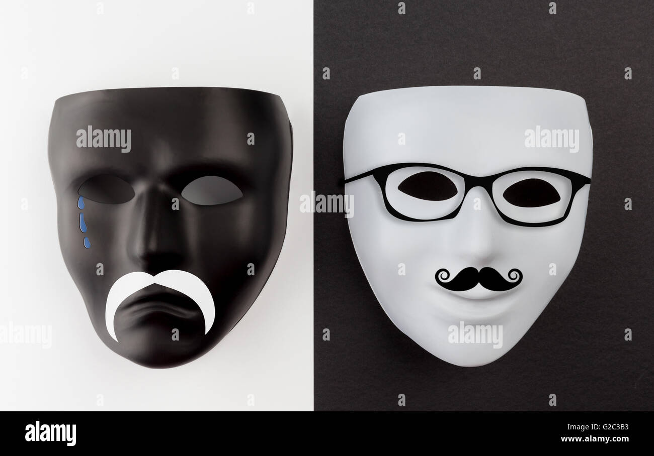 Black sad and white happy masks with mustache and glasses Stock Photo