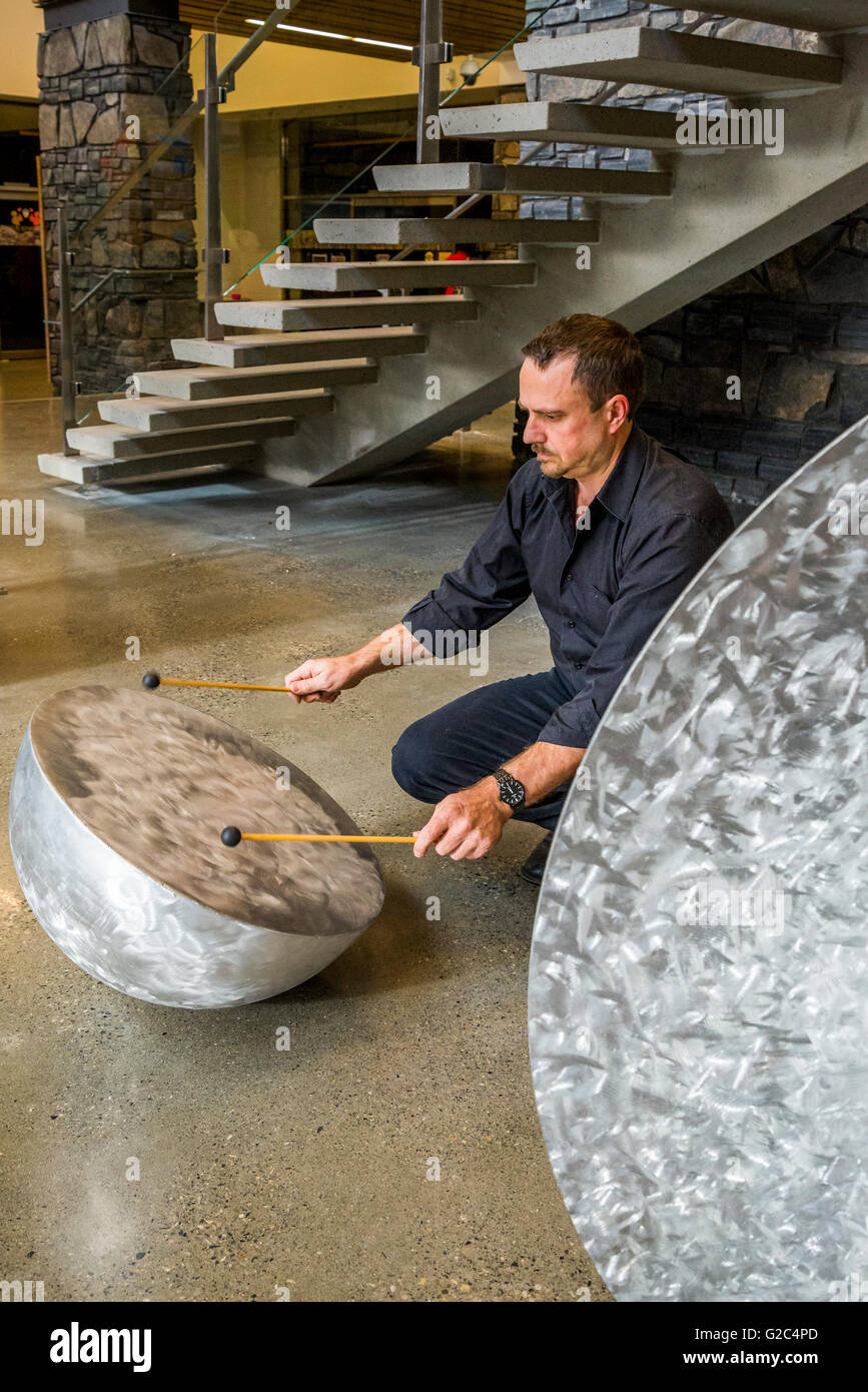 Tony bloom metal drum sculpture canmore hires stock photography and