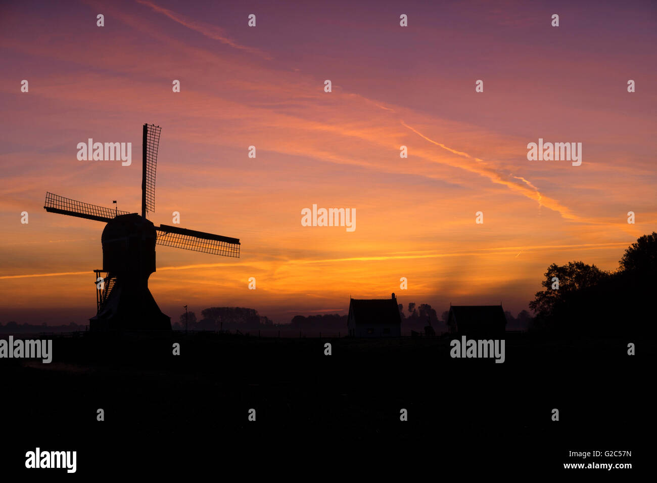 The windmill ‘Laaglandse molen’ in front of a spectacular sunrise Stock Photo