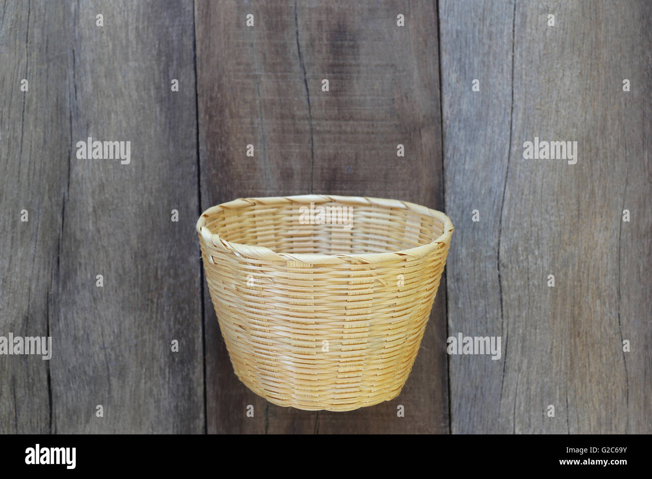 Basket weave of handicraft on old wooden for the design background. Stock Photo