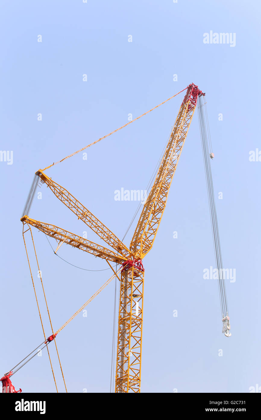 big crane on blue sky background in fine Weather. Stock Photo