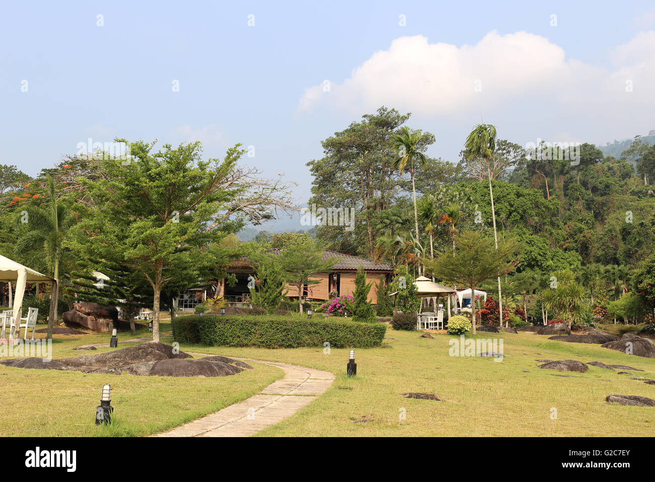 Green lawn of garden resort and have good weather in the morning. Stock Photo