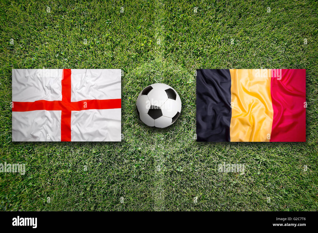 England vs. Belgium flags on a green soccer field Stock Photo - Alamy
