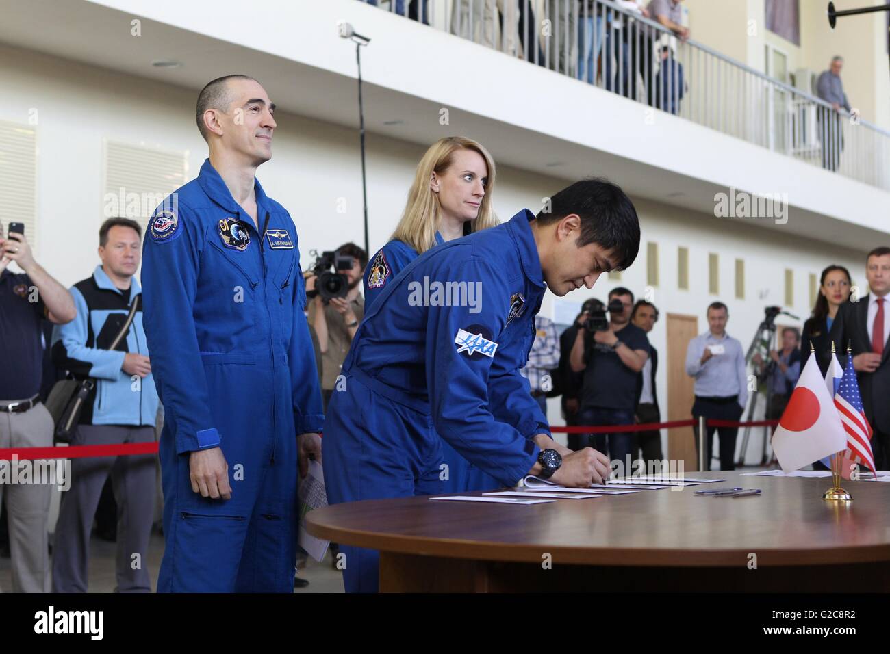 International Space Station Expedition 48 prime crew sign in for final flight exams pose at the Gagarin Cosmonaut Training Center May 26, 2016 in Star City, Russia. Crewmembers from L-R are: Russian cosmonaut Anatoly Ivanishin, Japanese astronaut Takuya Onishi and NASA astronaut Kate Rubins. Stock Photo