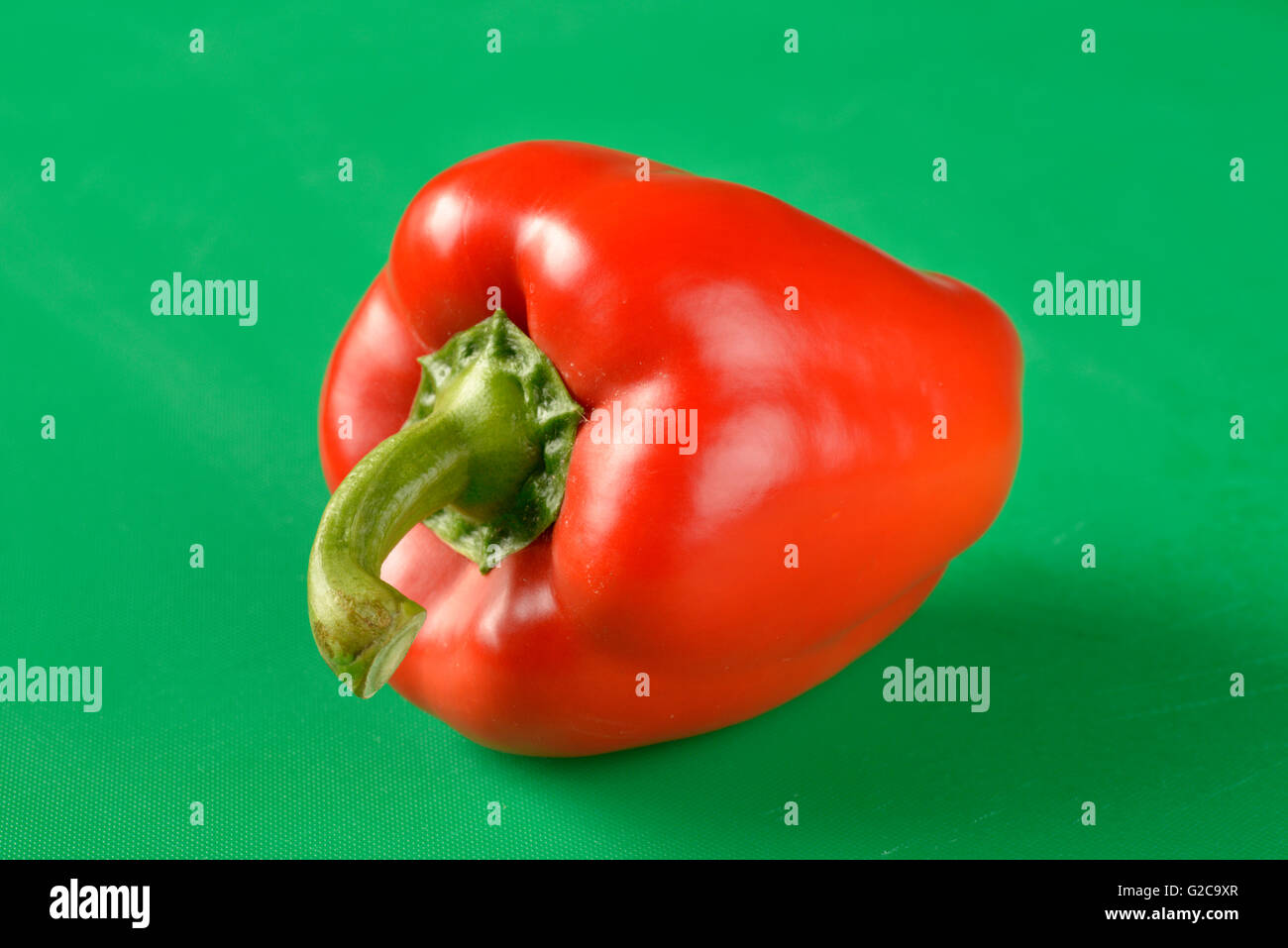 Red bell pepper on green chopping board - the correct colour board for ...