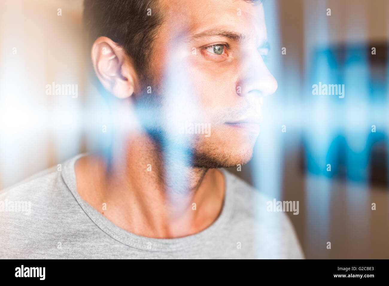 Multiexposure photo of a man and music waves. Hearing, perception of sounds and music Stock Photo