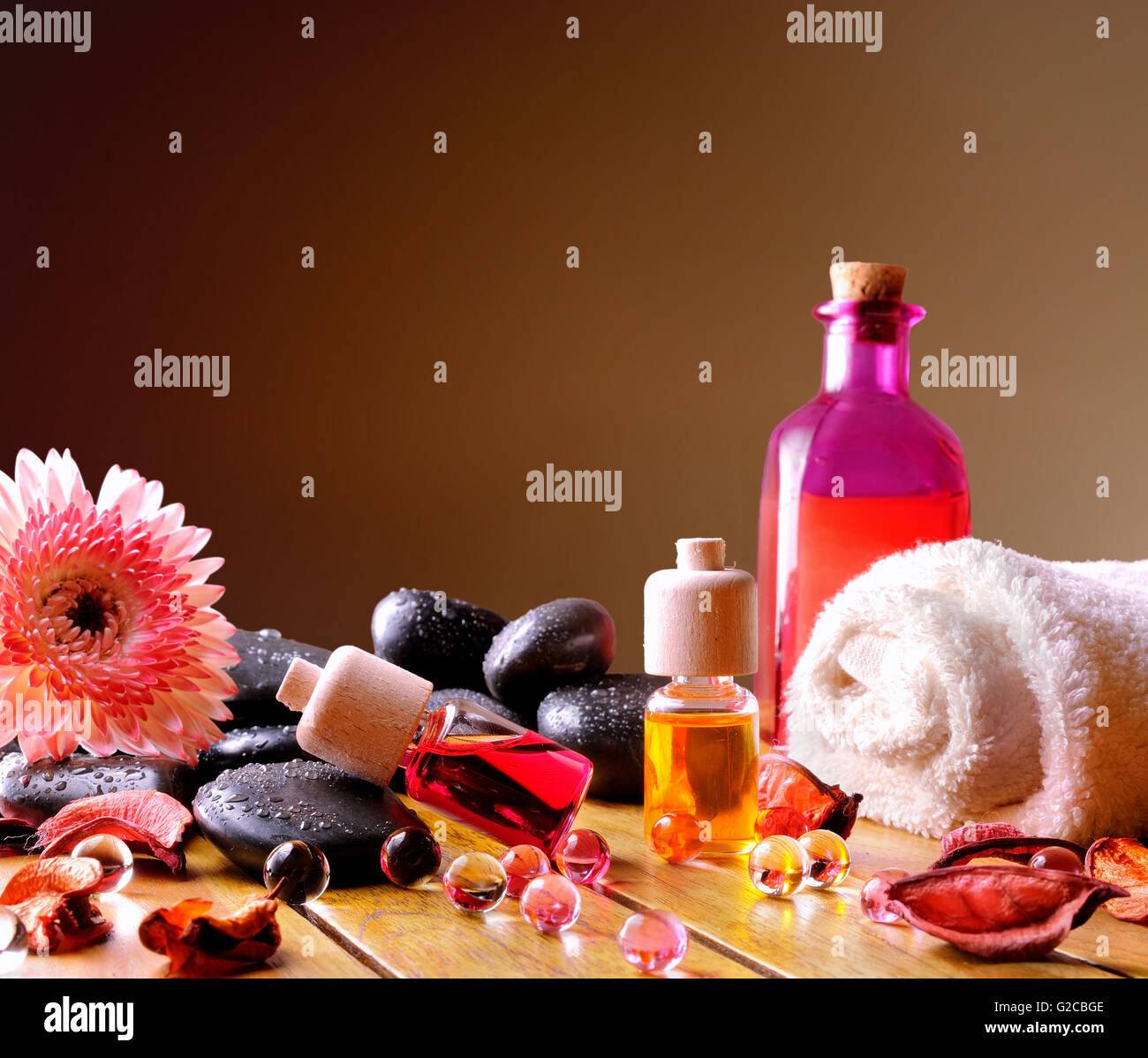 Containers and oil balls and essences for body care. With black stones