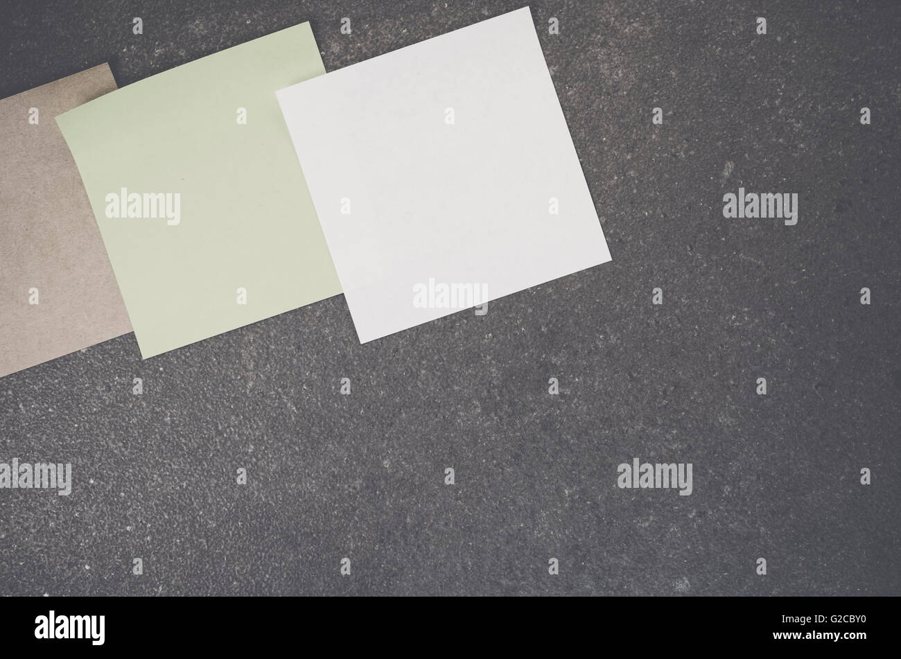 blank memos on a rough stone surface - space for your text Stock Photo