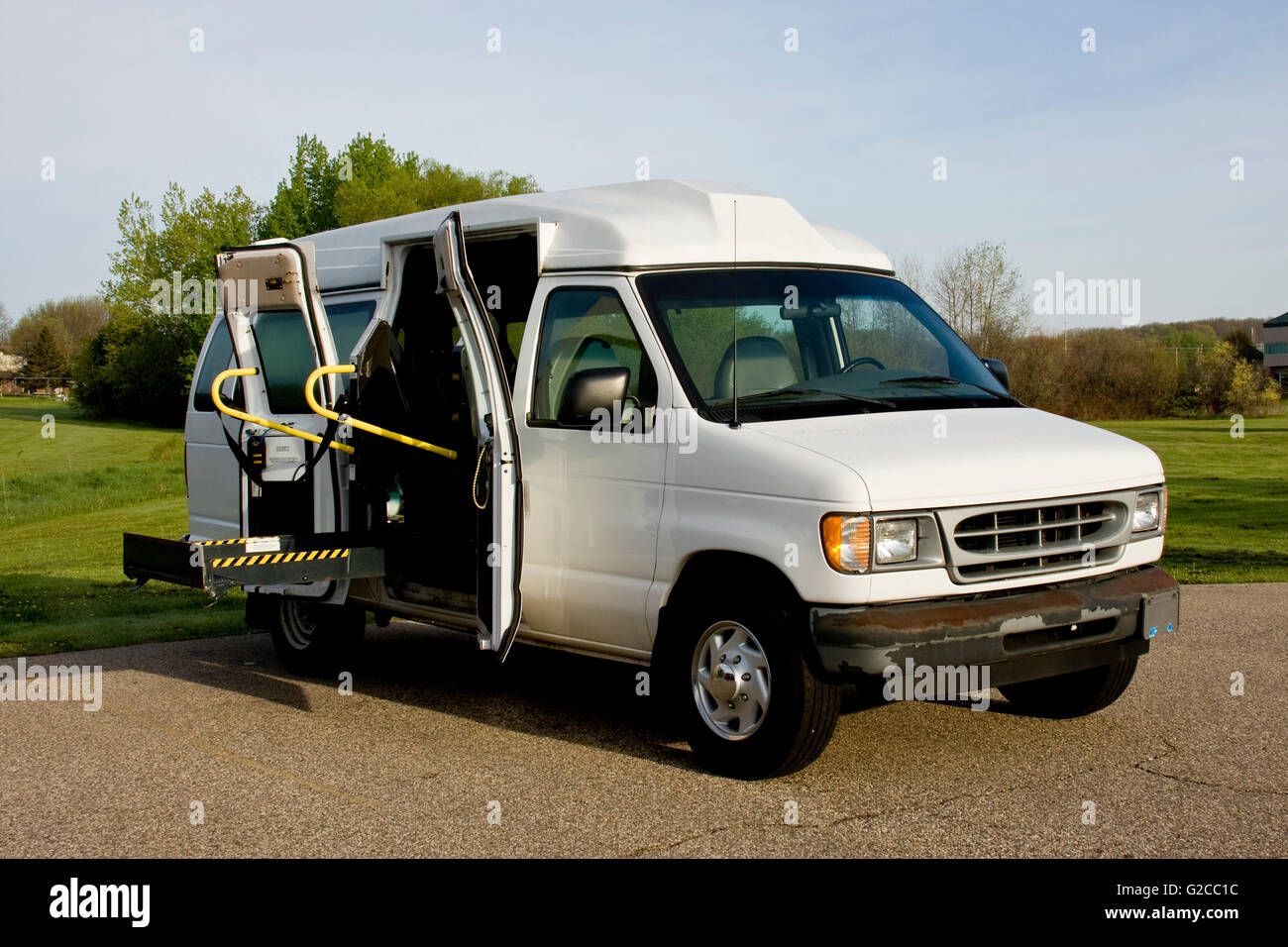 handicap van with a wheelchair lift in the up position Stock Photo Alamy
