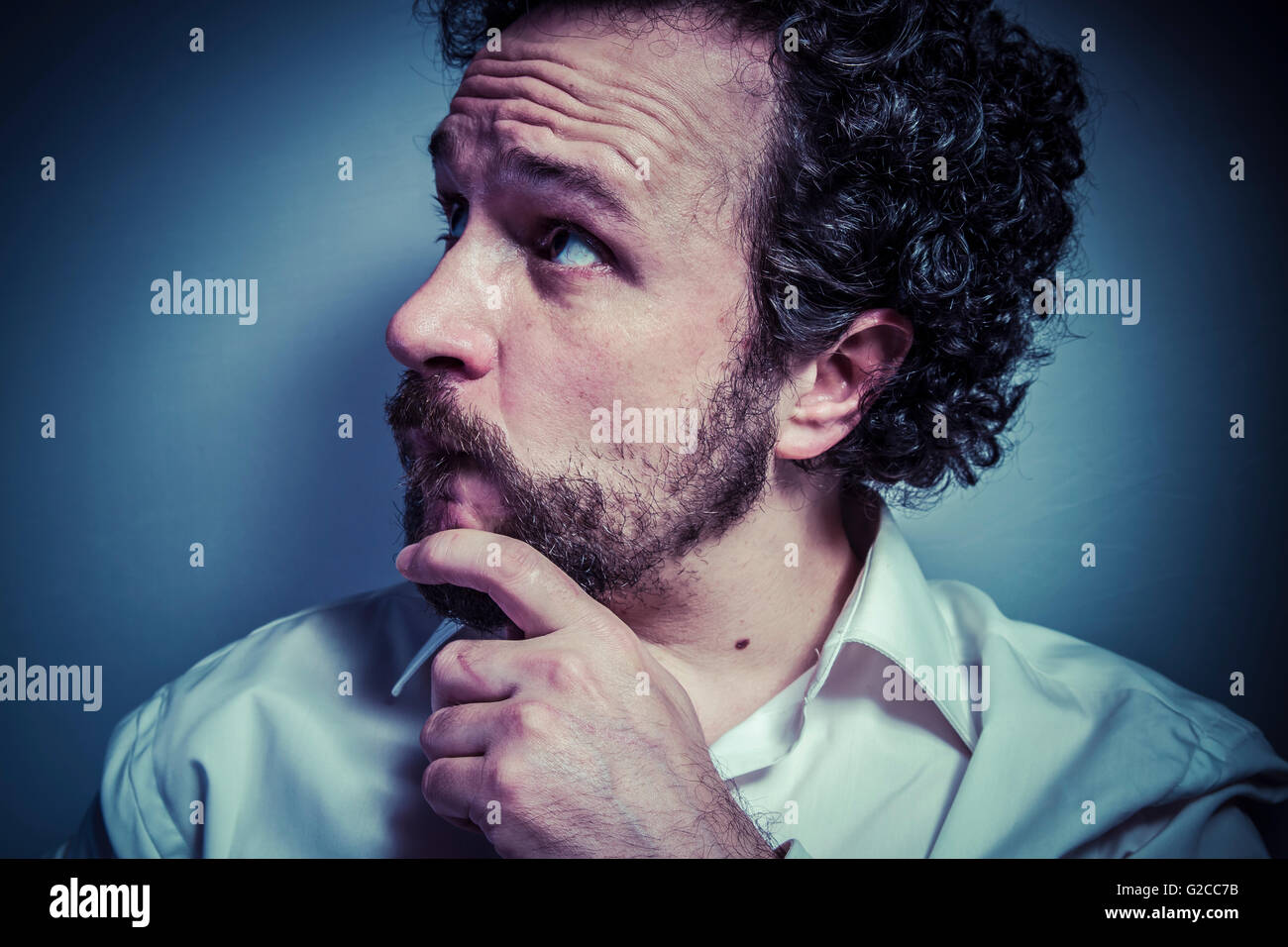 Fear, man with intense expression, white shirt Stock Photo - Alamy