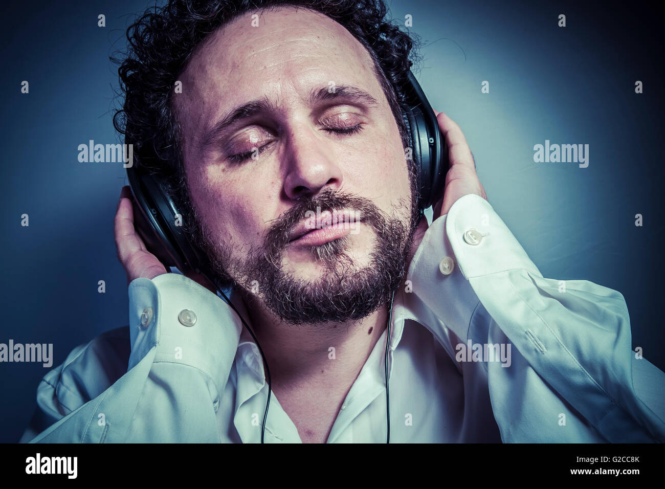 classical music, man with intense expression, white shirt Stock Photo