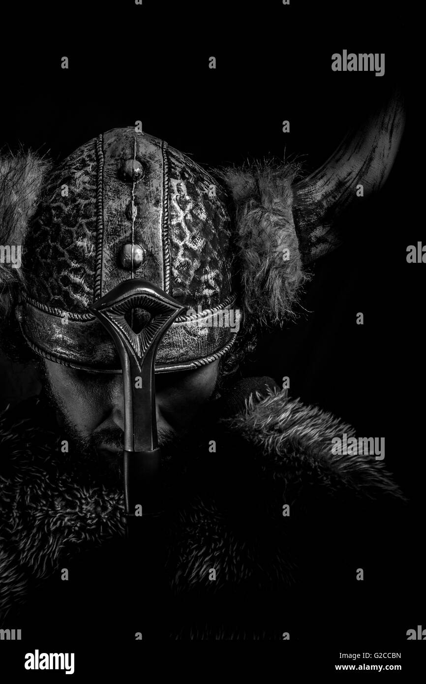 Costume, Viking warrior with a huge sword and helmet with horns Stock Photo