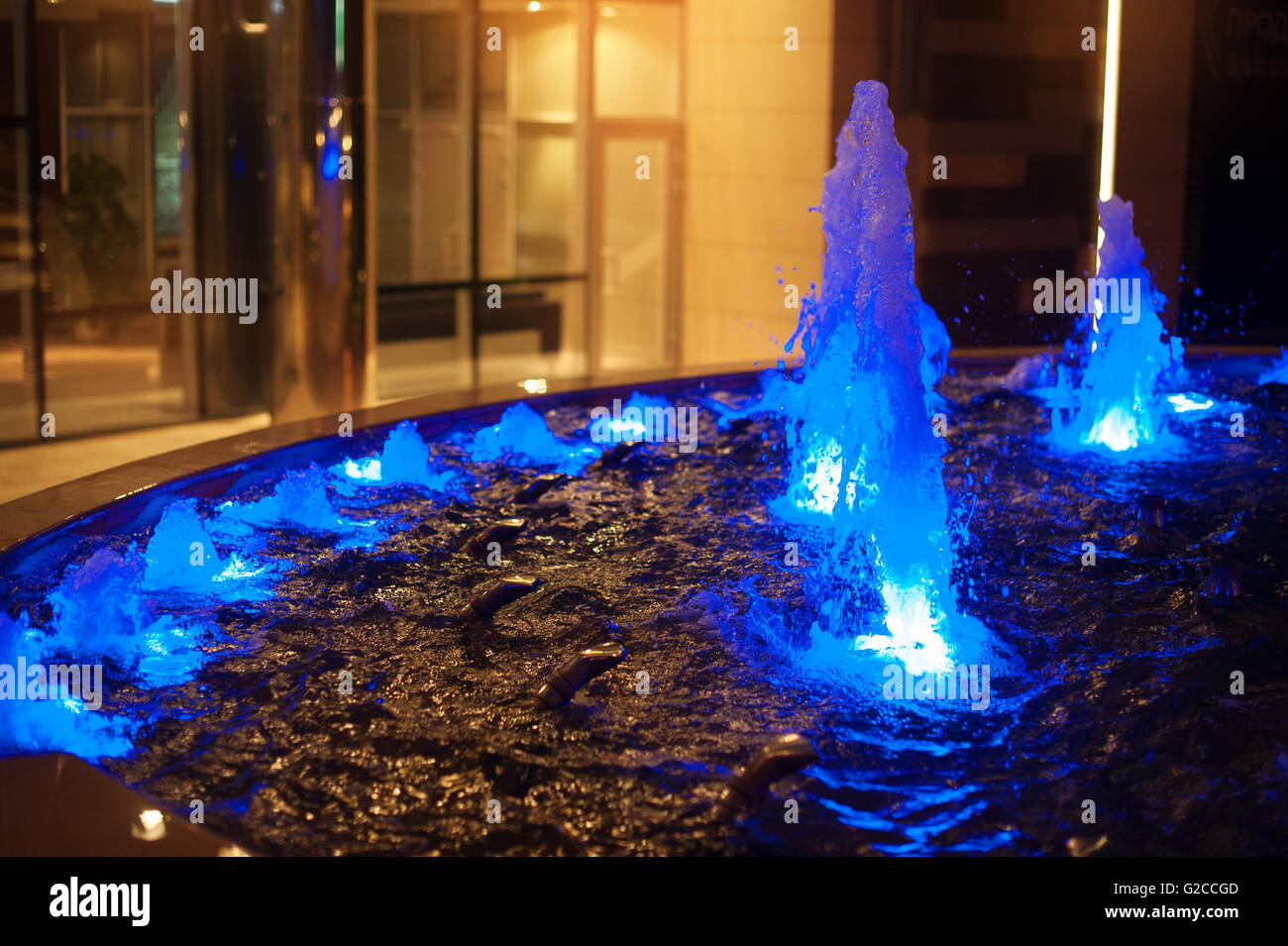 blue illuminated fountains in the night city Stock Photo - Alamy