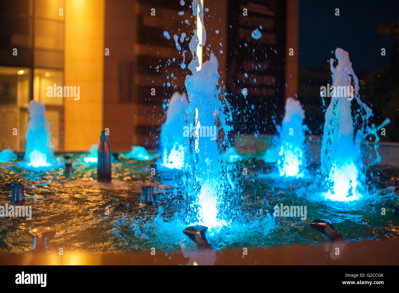 blue illuminated fountains in the night city Stock Photo - Alamy