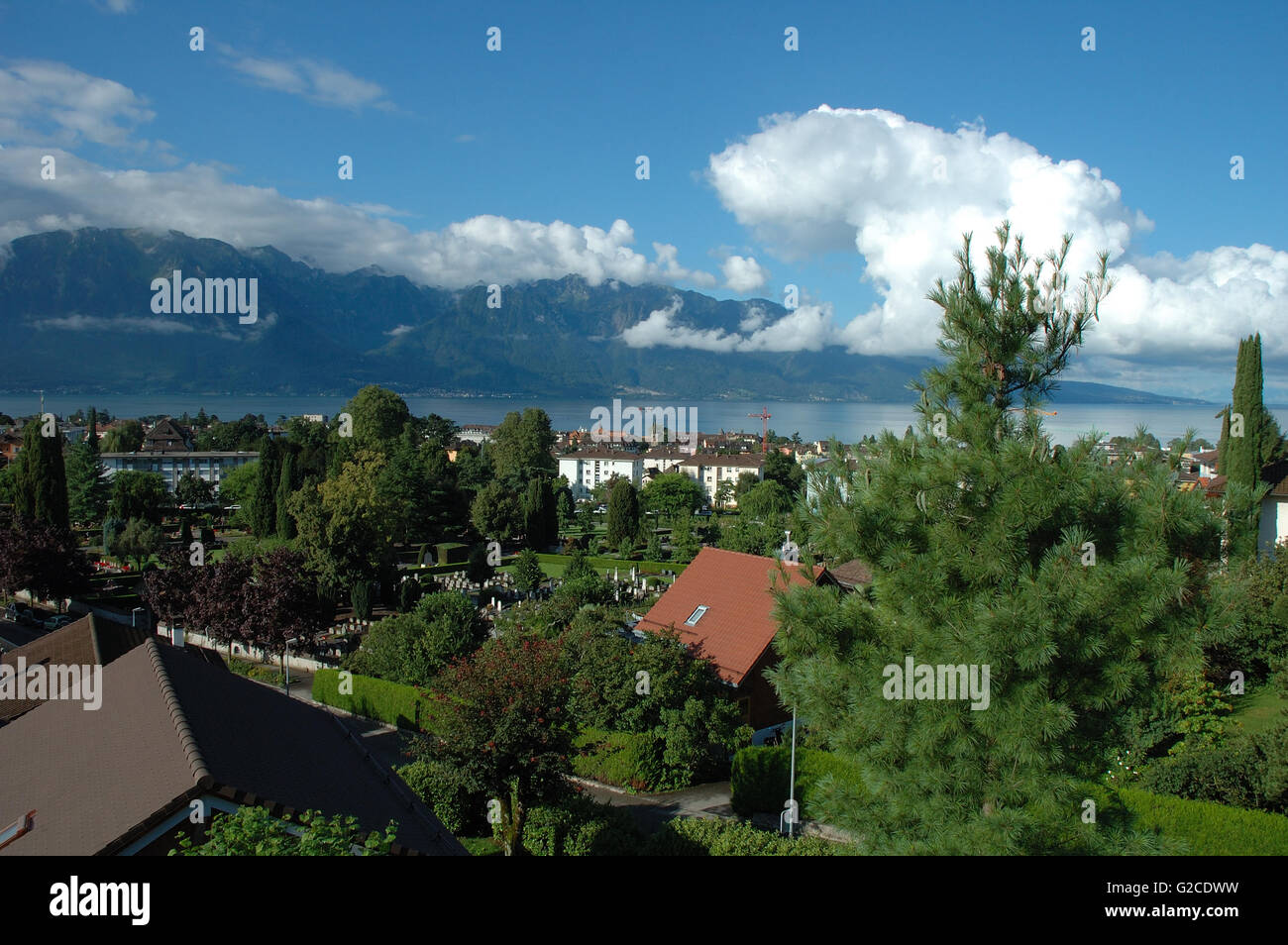 Mountains, Geneve lake and buildings in La TourdePeilz in Switzerland
