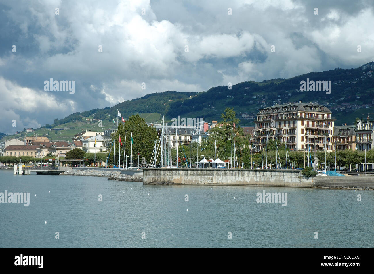 Vevey, Switzerland - August 16, 2014: Buildings in Vevey at Geneve lake in Switzerland. Unidentified people visible. Stock Photo