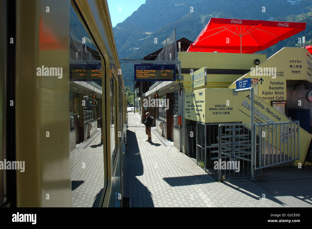 Grindelwald, Switzerland - August 18, 2014: Platform on railway station in Grindelwald in Switzerland. Unidentified man visible. Stock Photo