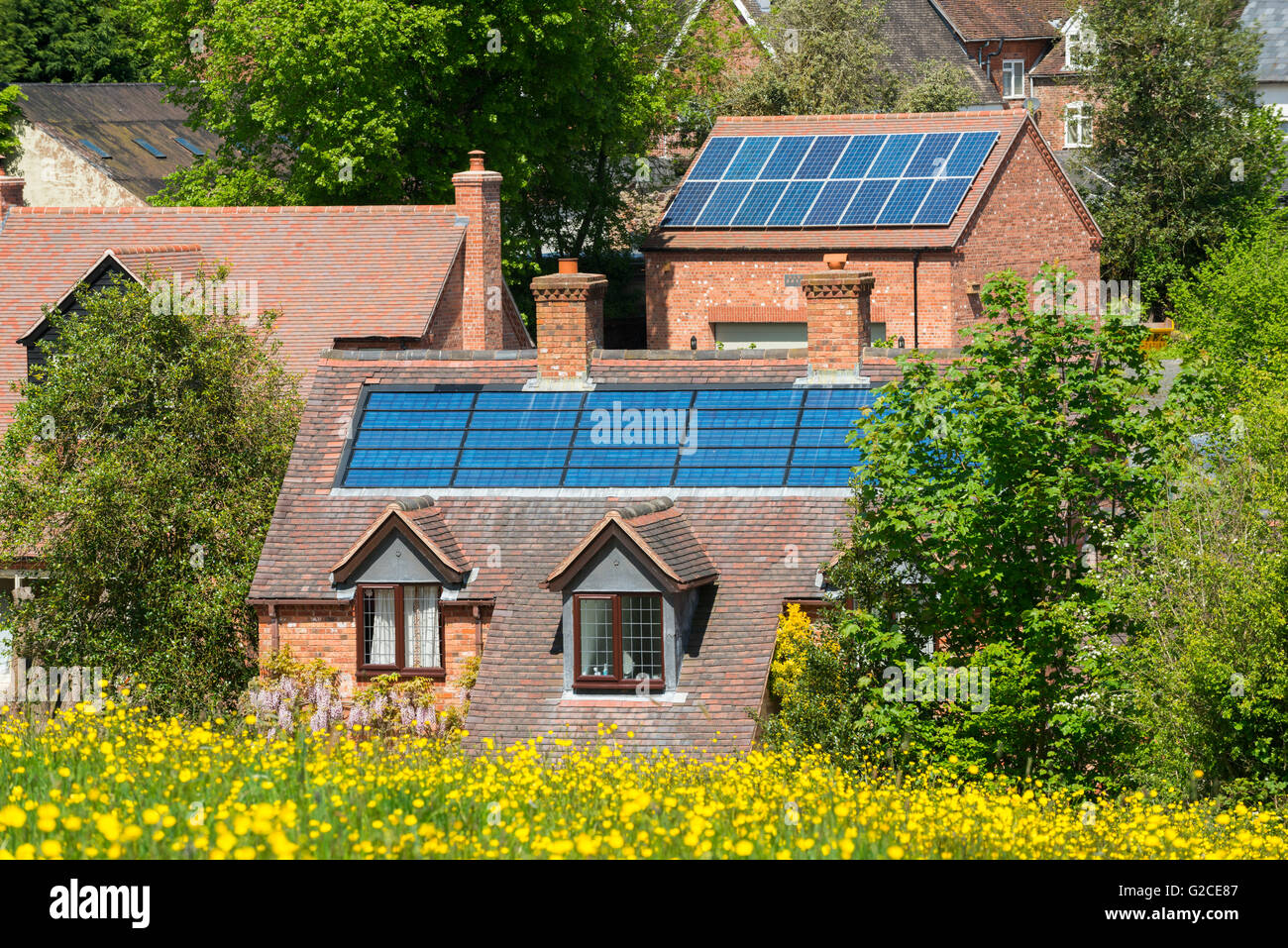 Photovoltaic panels on buildings in Cleobury Mortimer, Shropshire, England, UK. Stock Photo