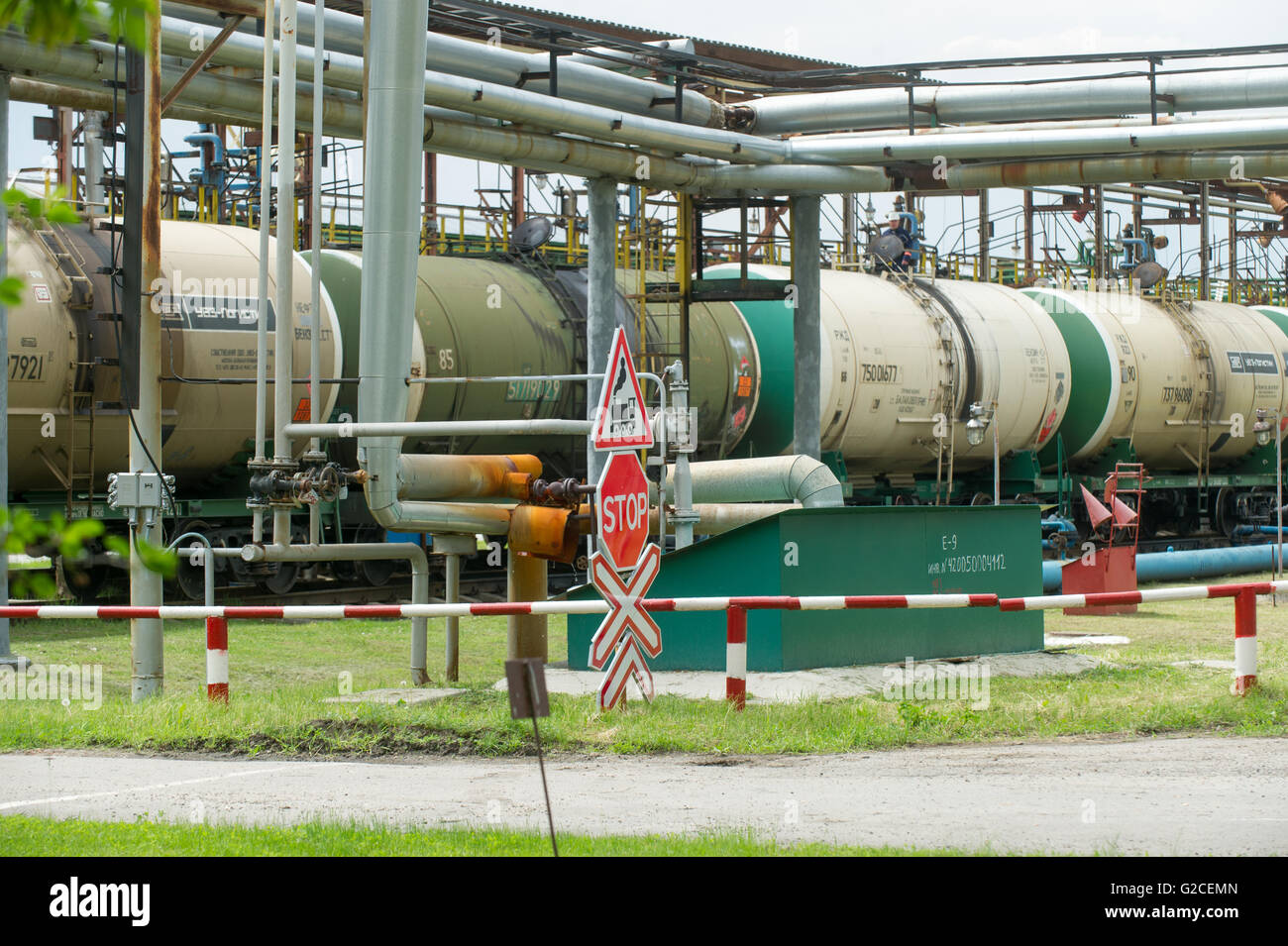 Old fuel tanks at the oil terminal on railway station on a summer day
