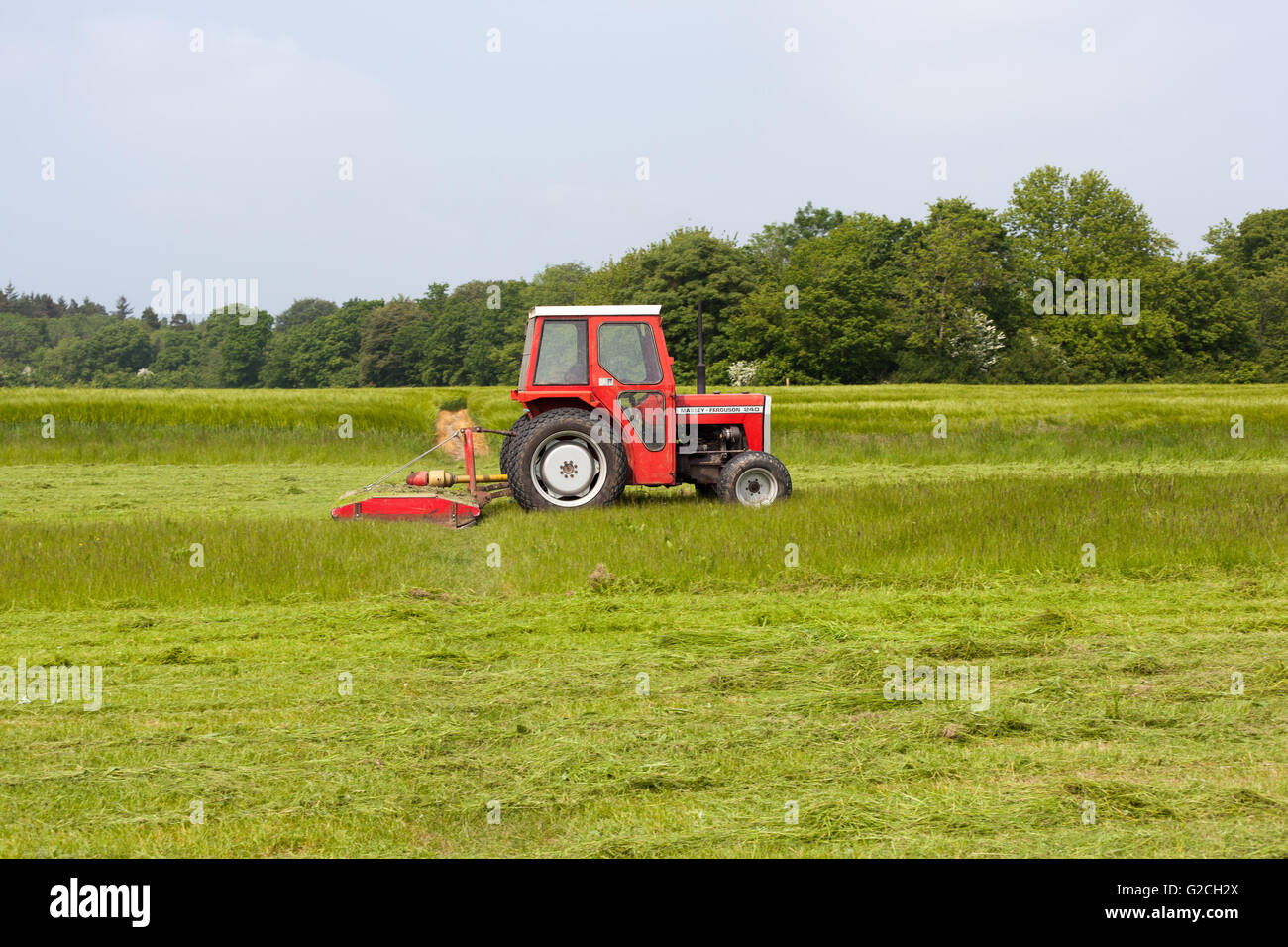 A tractor in a field in Kent, England. Stock Photo