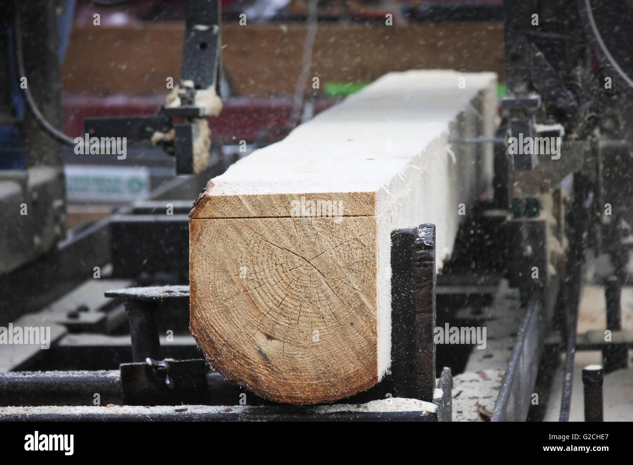 portable saw mill cutting a log into boards Stock Photo Alamy