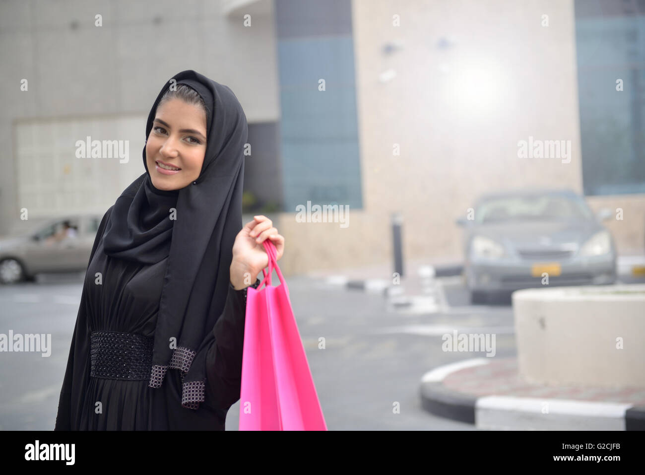 Emarati Arab women coming out of shopping in Dubai, United Arab Emirates. Stock Photo