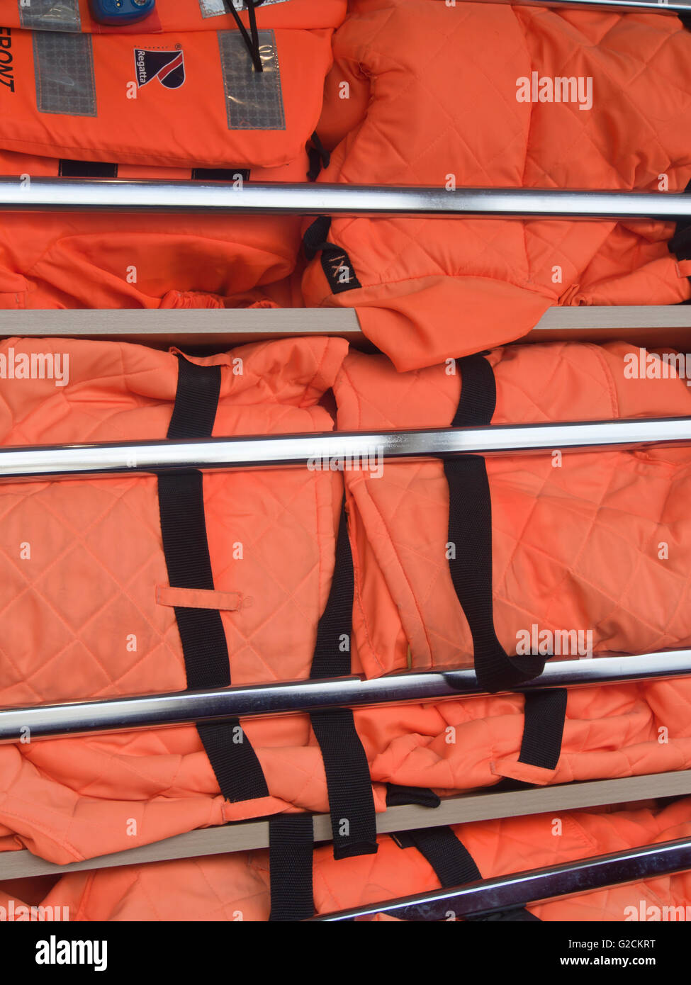 Stack of life vests on board a passenger ferry on the Oslo fjord for easy access in case of an emergency Stock Photo