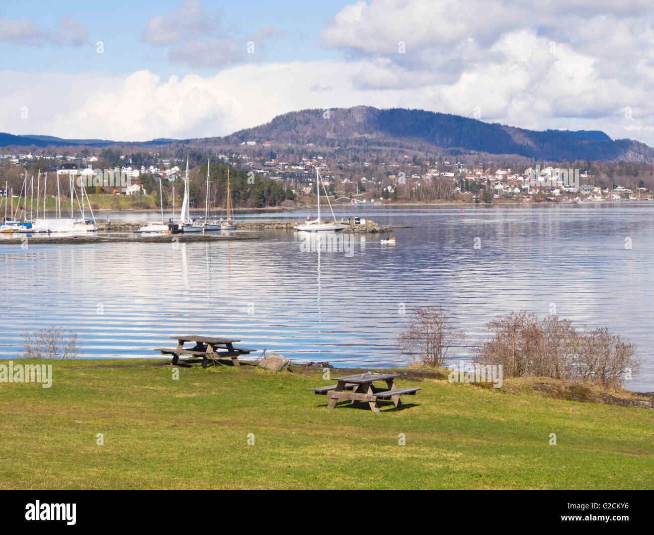 Picnic spot on the Oslo fjord with tables and benches, springtime in Vollen Asker Norway Stock Photo