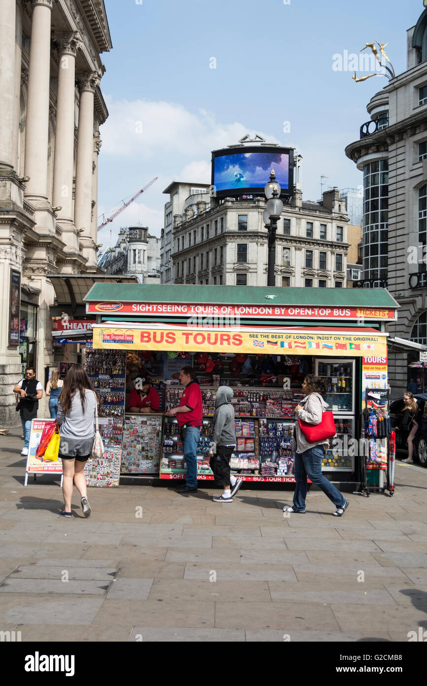 People passing in front of a ticket booth in Piccadilly Circus in central London, UK Stock Photo
