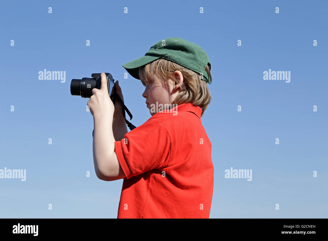 young boy taking photos Stock Photo