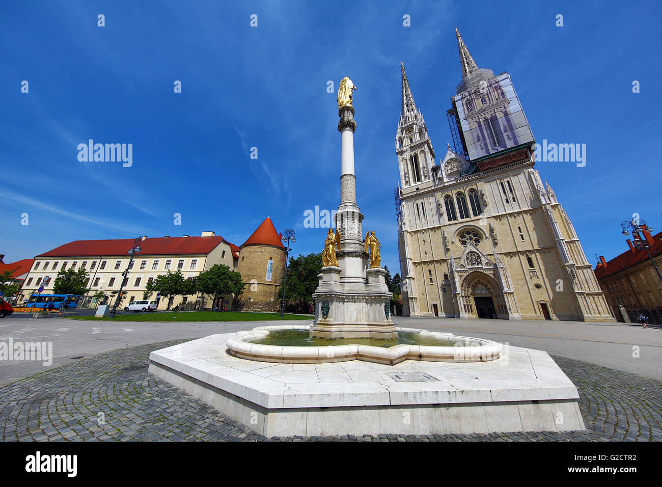 Zagreb Cathedral with tower renovation and Holy Mary Monument column in Zagreb, Croatia Stock Photo