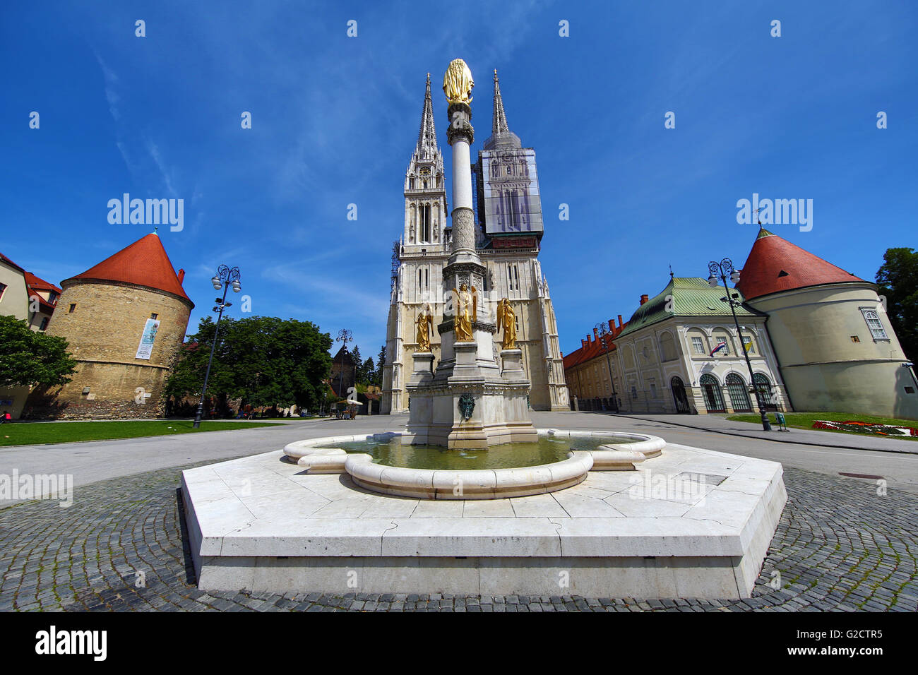 Zagreb Cathedral with tower renovation and Holy Mary Monument column in Zagreb, Croatia Stock Photo