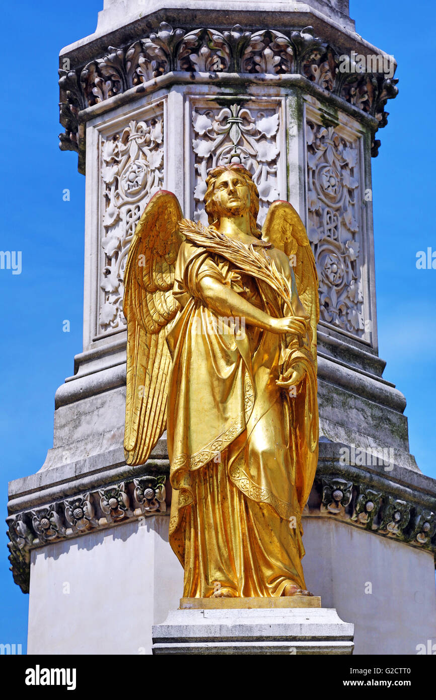 Gold angel statue on the Holy Mary Monument column beside Zagreb Cathedral in Zagreb, Croatia Stock Photo
