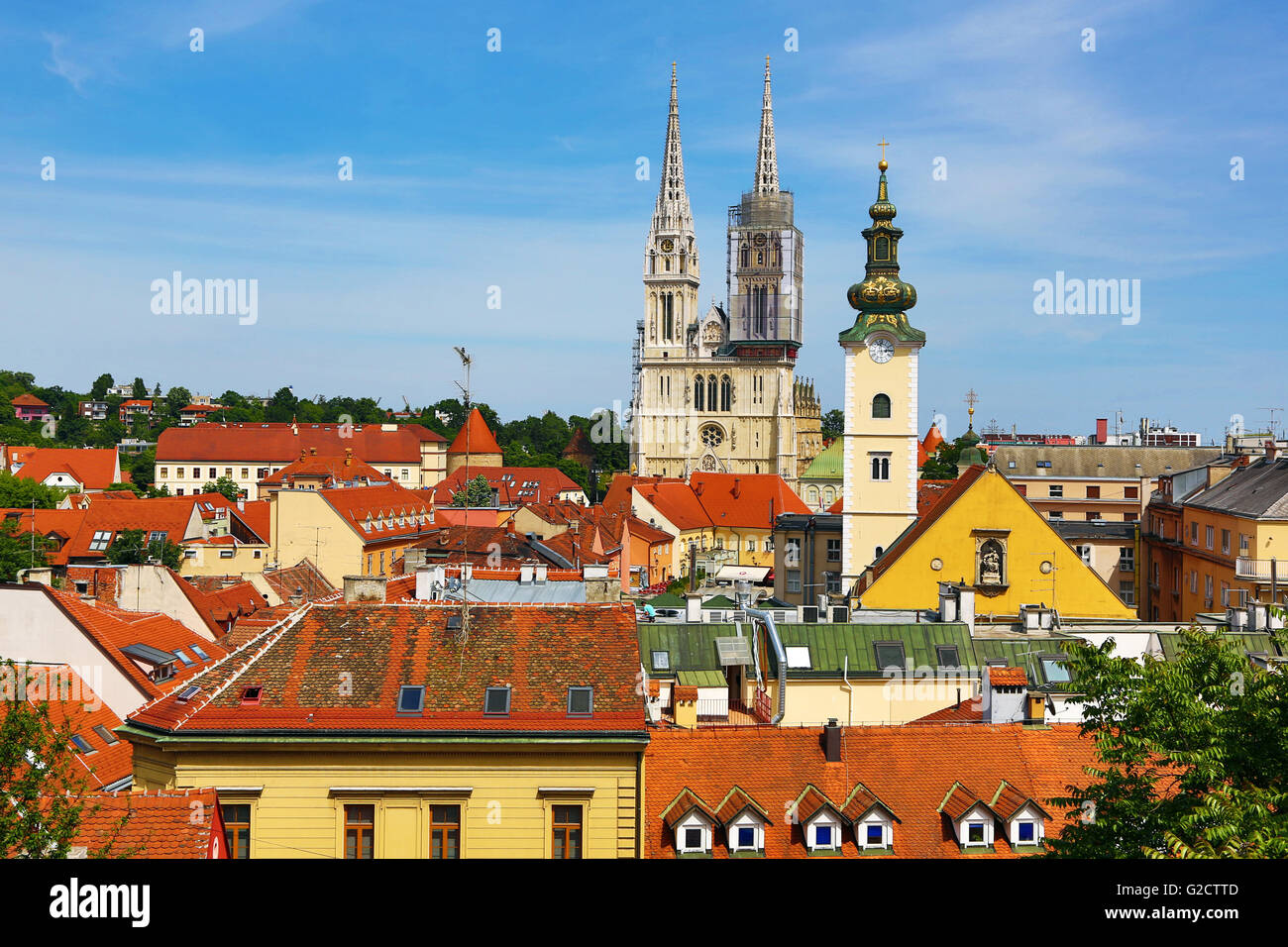 General city skyline view of Zagreb Cathedral with tower renovation and the tower of St. Mary's Church in Zagreb, Croatia Stock Photo