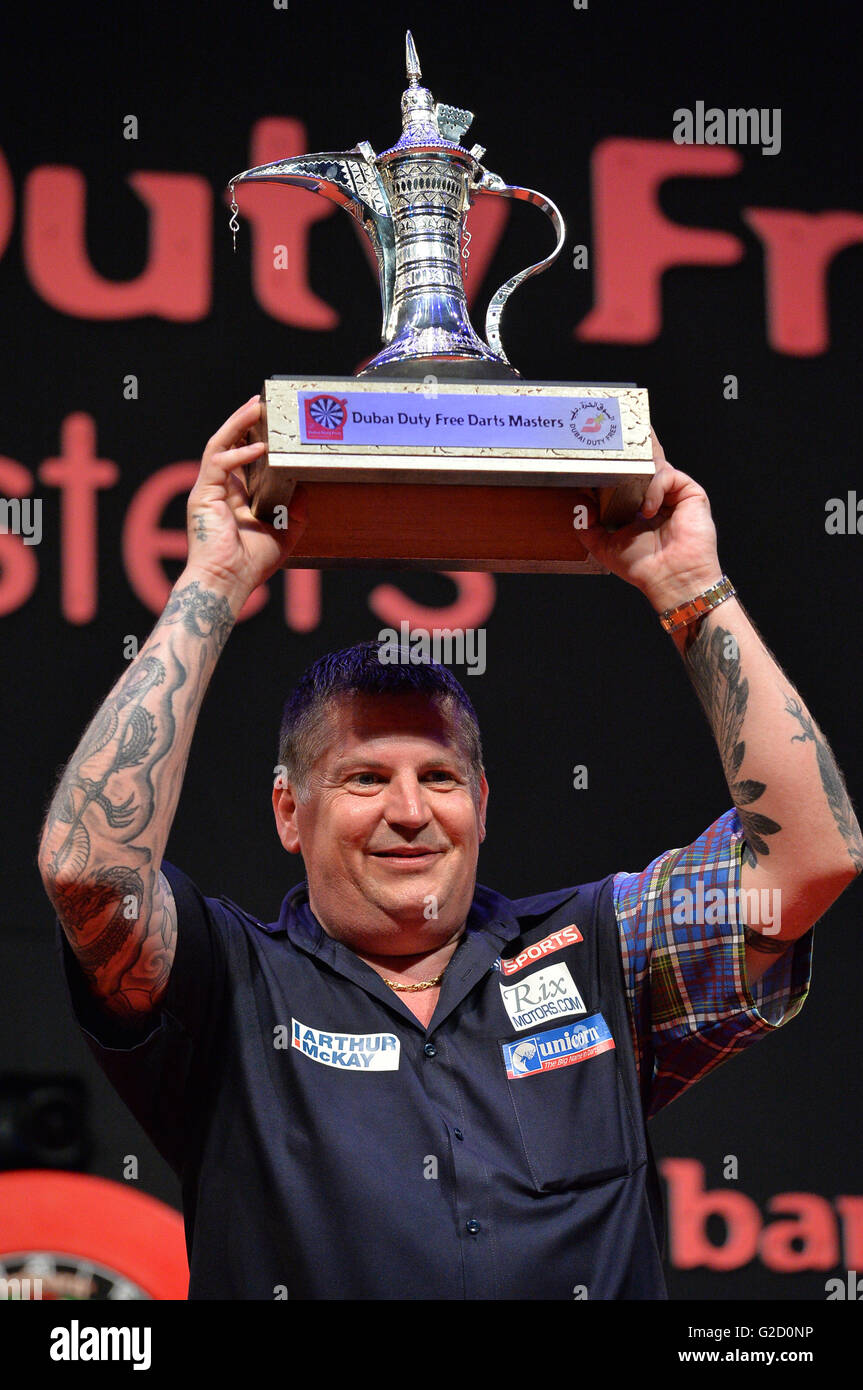 DUBAI, UAE, 27th March 2016. Scotland's Gary Anderson celebrates after  receiving the the 2016 Dubai Duty Free Darts Masters trophy. Current PDC World  Champion Anderson beat defending three time DDF Darts Masters