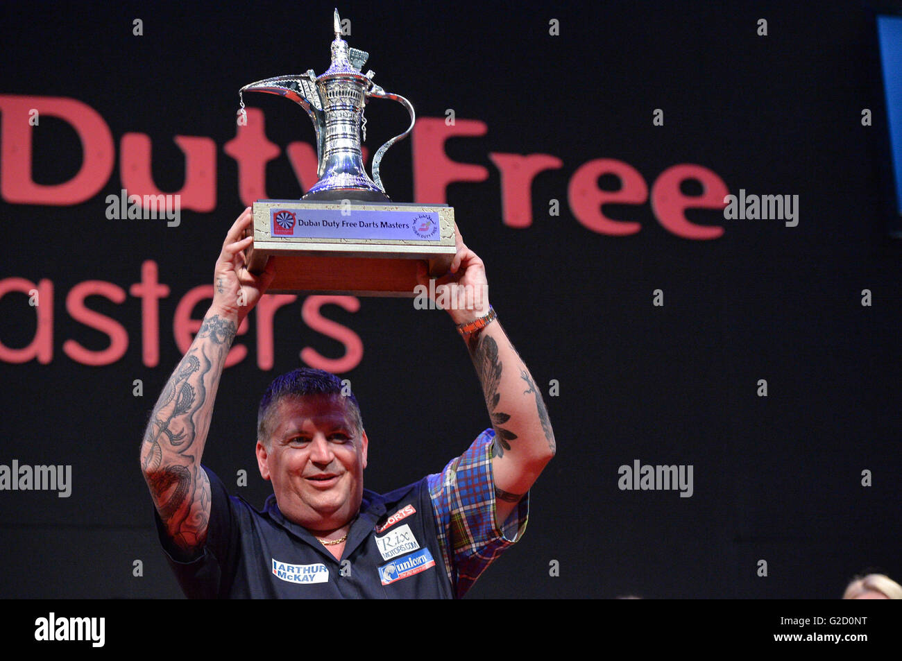 DUBAI, UAE, 27th March 2016. Scotland's Gary Anderson celebrates after  receiving the the 2016 Dubai Duty Free Darts Masters trophy. Current PDC  World Champion Anderson beat defending three time DDF Darts Masters