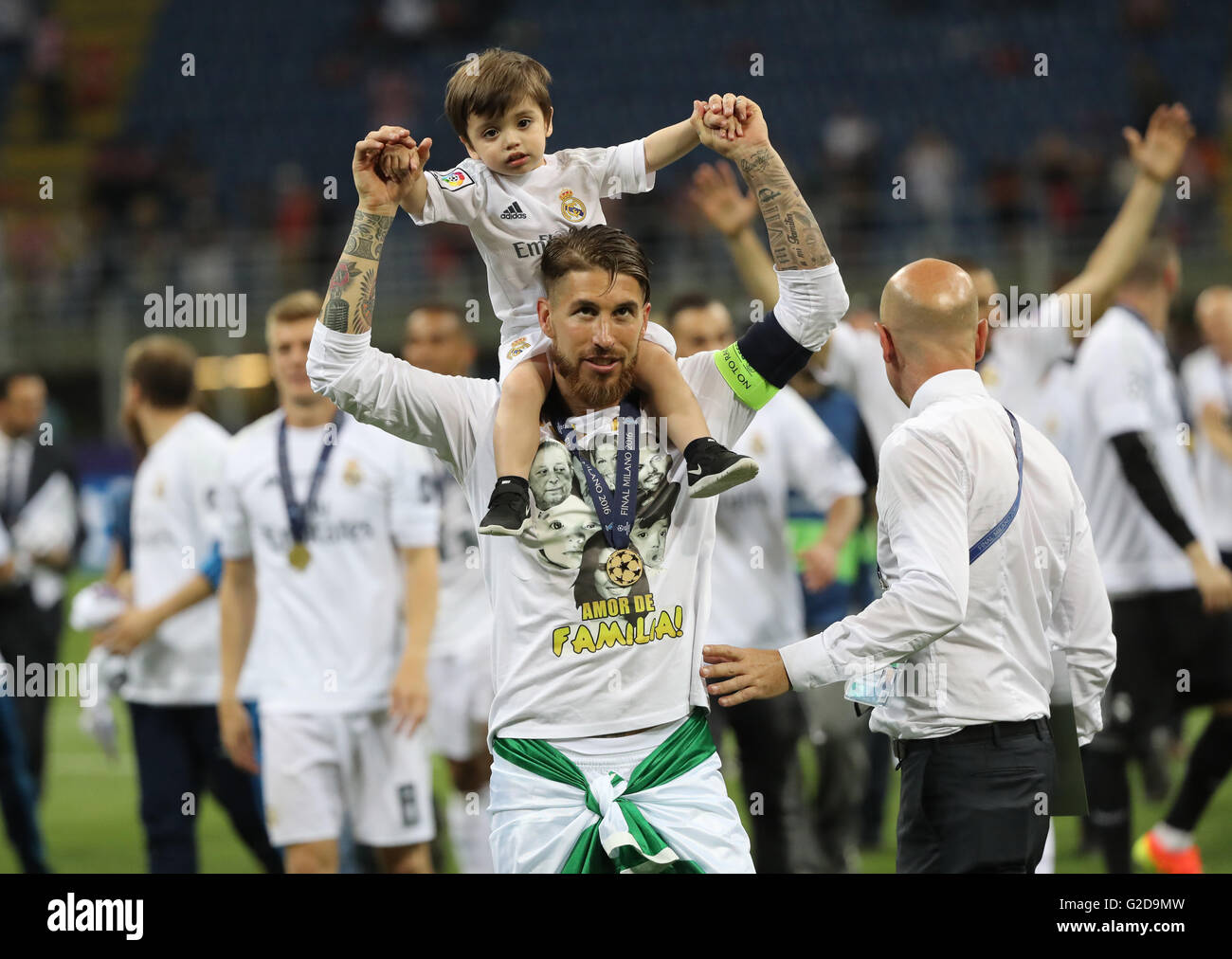 Milan, Italy. 28th May, 2016. Real's captain Sergio Ramos celebrates with child after winning the UEFA Champions League Final between Real Madrid and Atletico Madrid at the Stadio Giuseppe Meazza in Milan, Italy, 28 May 2016. Photo: Christian Charisius/dpa/Alamy Live News Stock Photo