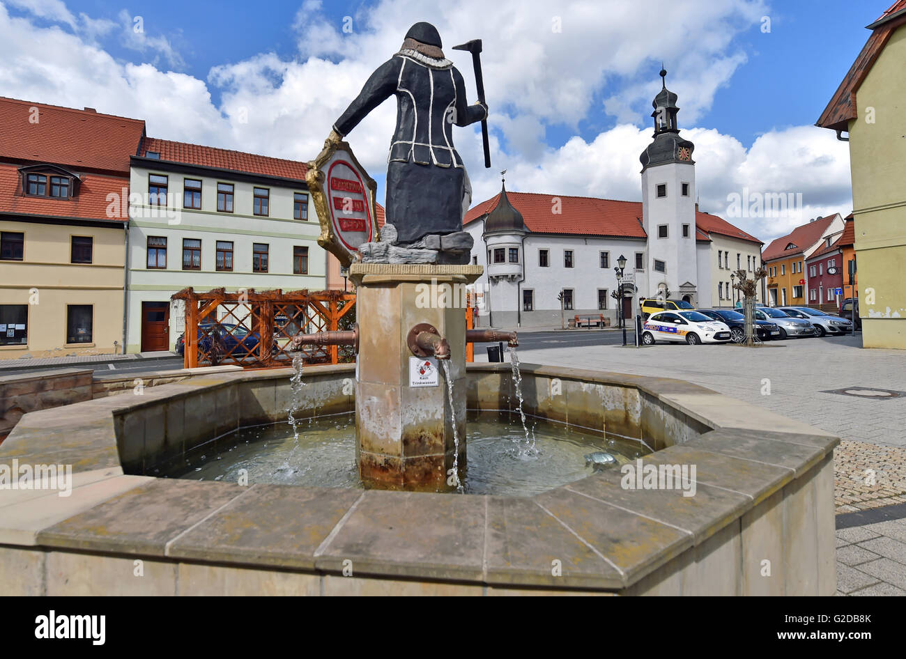 Gerbstedt, Germany. 25th Apr, 2016. 'Kamerad Martin', symbol for the mining workes in the region, standing on a well in the town of Gerbstedt, Germany, 25 April 2016. Below the city lies a historical basement which is part of the convent that supposedly was founded around 969 by Margrave Rikdag von Meissen for the Benedictines. Parts of the wide basement are still preserved and can be viewed during a visit to the museum. PHOTO: HENDRIK SCHMIDT/dpa/Alamy Live News Stock Photo