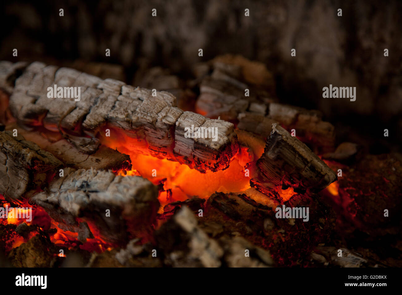 Burning and glowing pieces of wood in Fireplace Stock Photo - Alamy