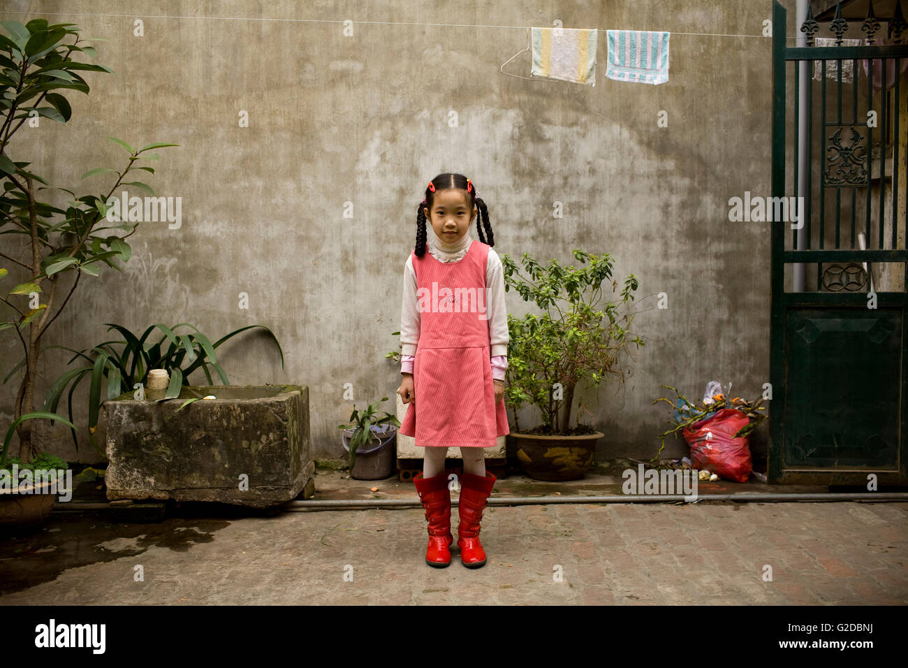 Young Vietnamese Girl in Yard, Portrait Stock Photo