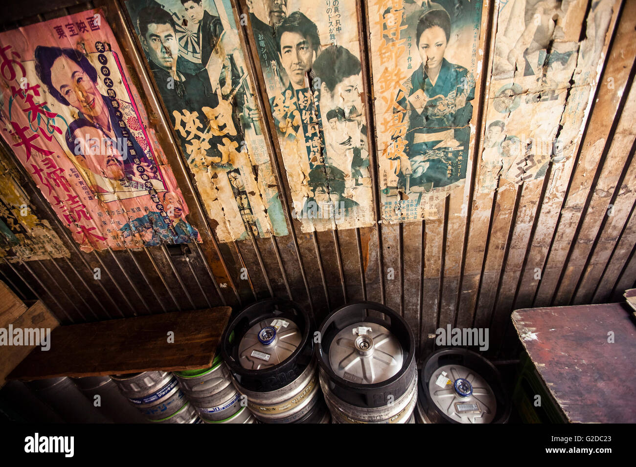 Old Posters and Advertisements With Kegs of Beer in Bar, Tokyo, Japan Stock Photo