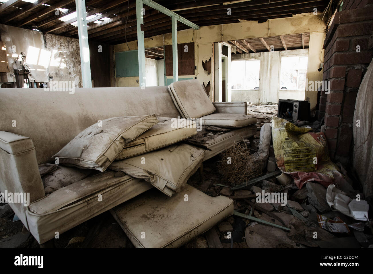 Dirty Old Couch in an Abandoned House Stock Photo