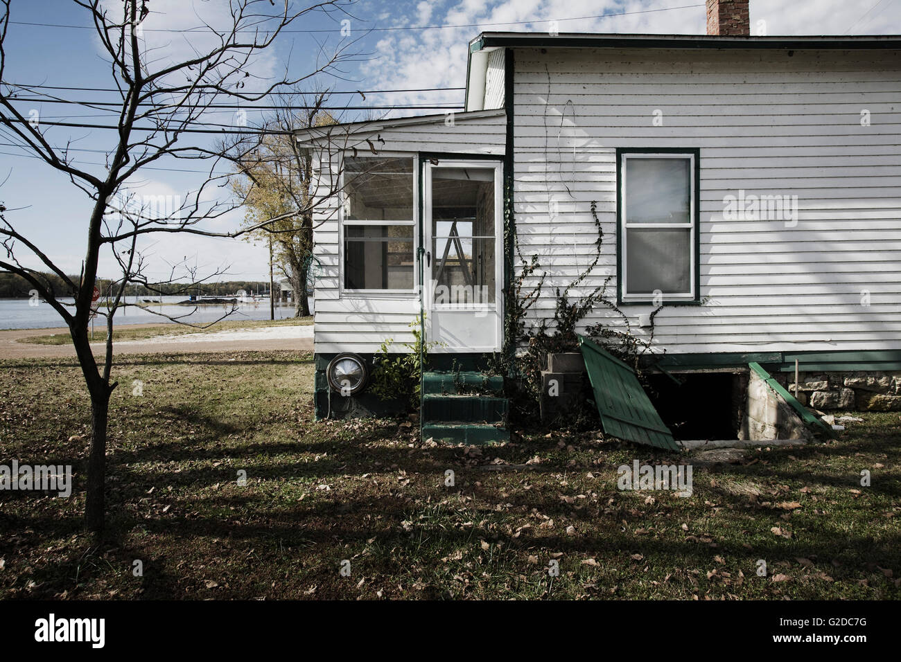 Side of House With Bare Tree in Yard, Grafton, Illinois, USA Stock