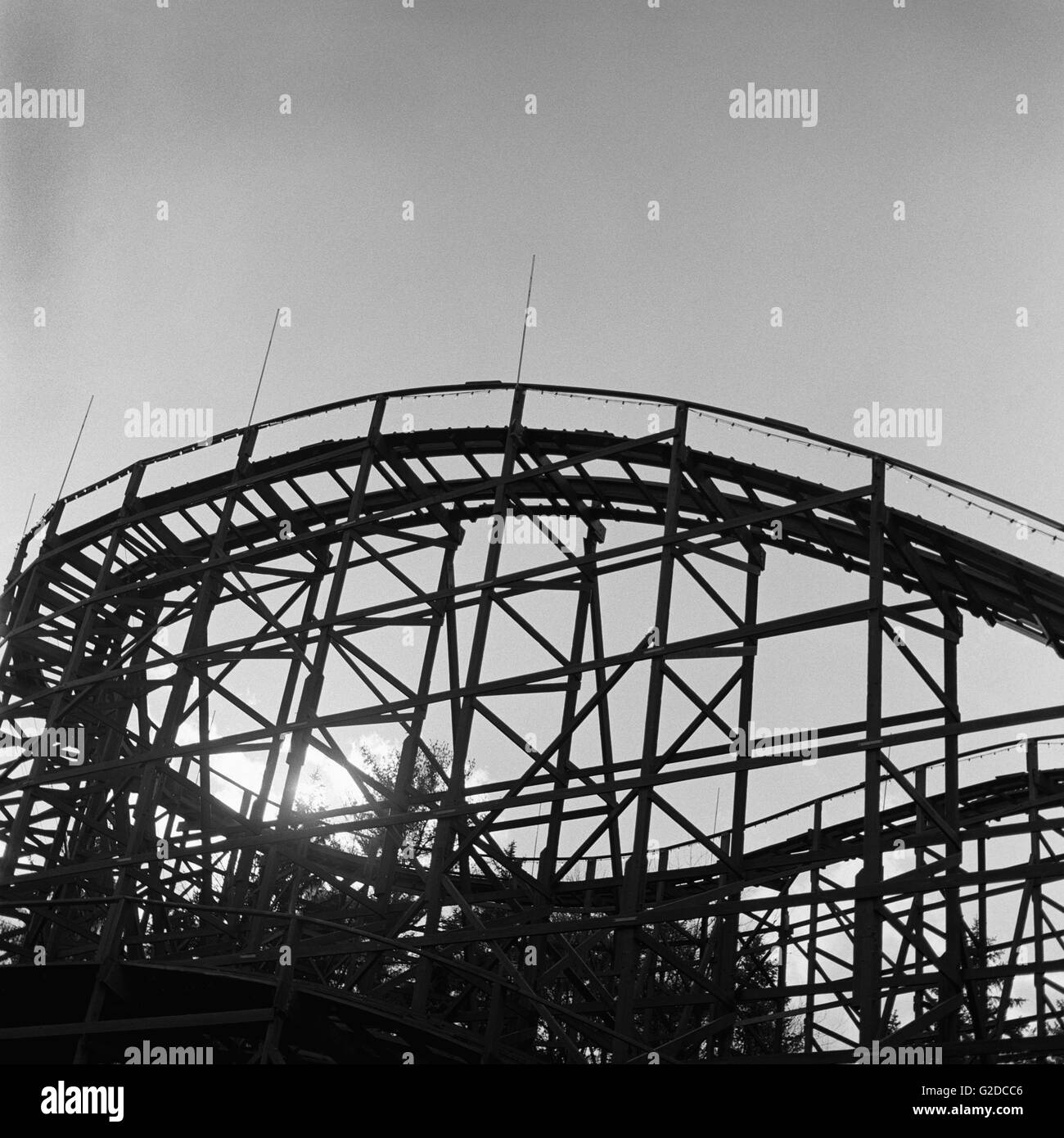 Silhouetted Wooden Roller Coaster Stock Photo