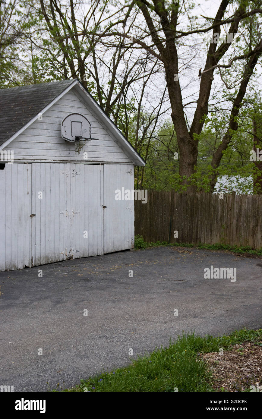 Basketball Hoop Above Rustic Garage Doors Stock Photo - Alamy